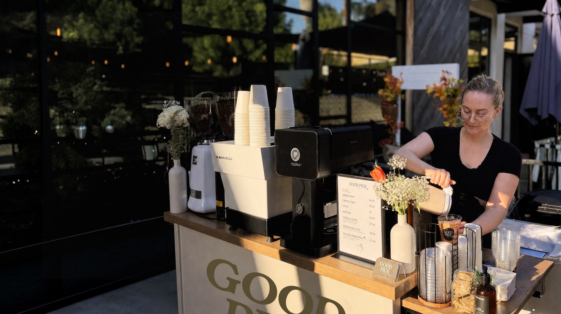 Good Pick barista serving espresso from a mobile coffee cart at an outdoor event near Malibu, California