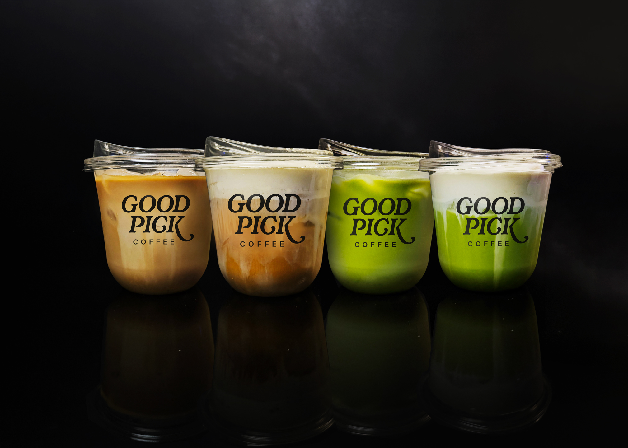 Four Good Pick coffee and matcha cups lined up